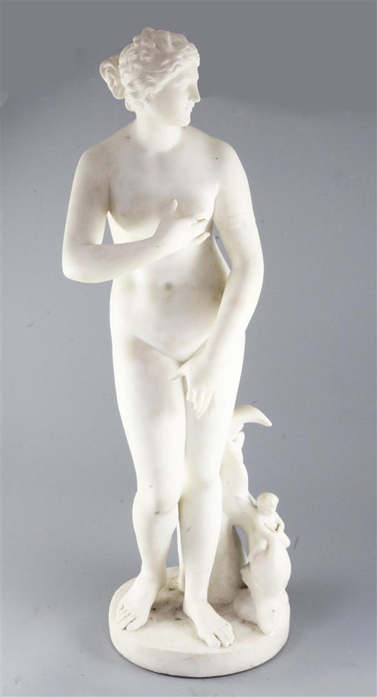 After the antique. A carved white marble figure of Venus standing alongside a dolphin ridden by cherubs, height 30in.